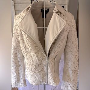Cream color/off white with embroidery design.